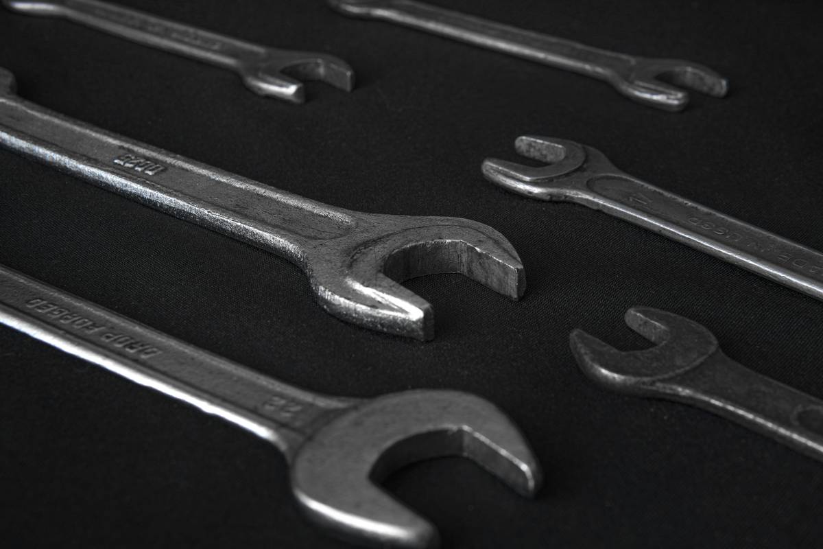 Close-up of martin tools wrenches gripping a rusted bolt without slippage